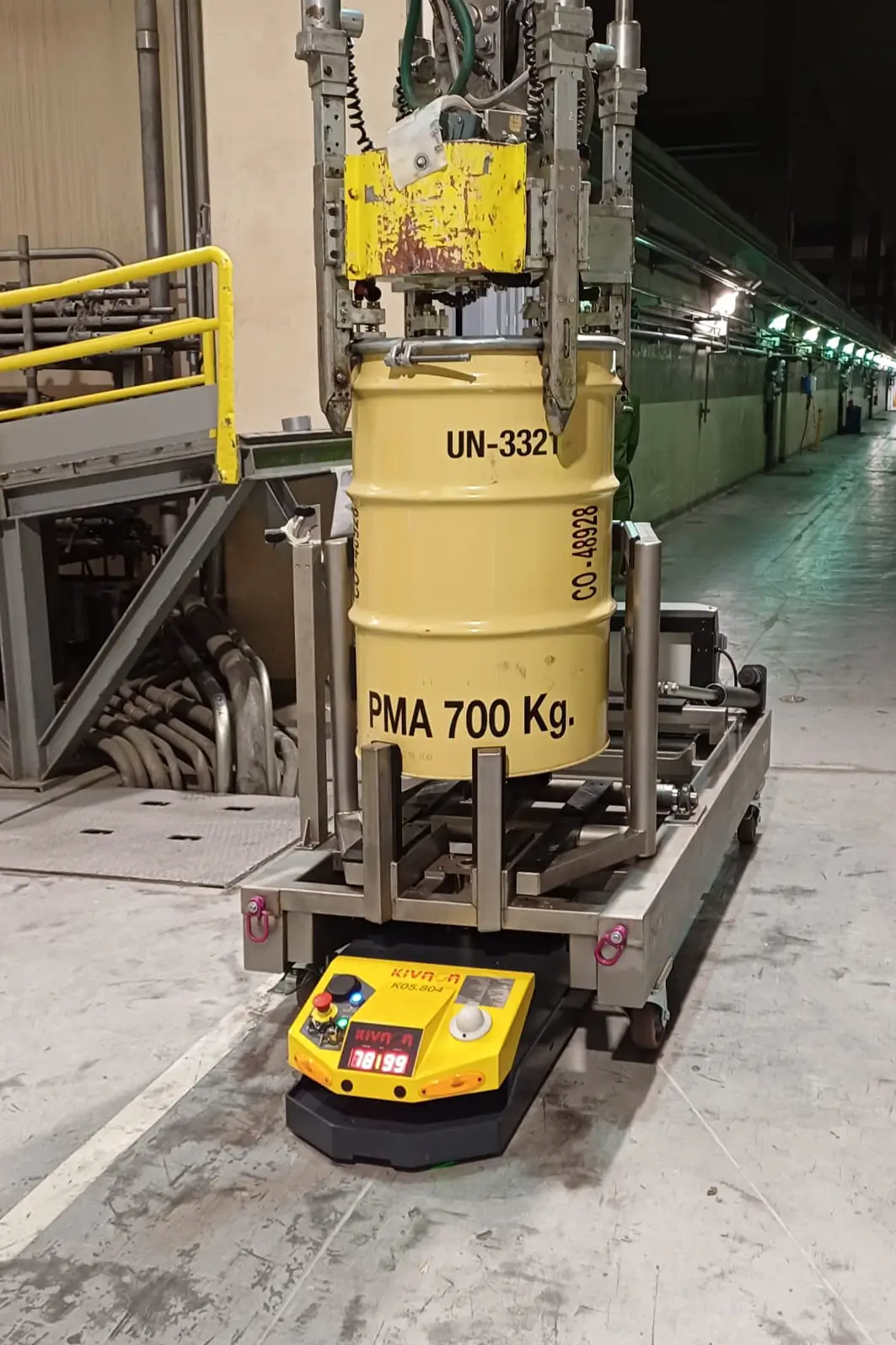 AGV robot carrying a 700 kg radioactive waste drum with automated lifting system inside Cofrentes NPP. NUSPIDER