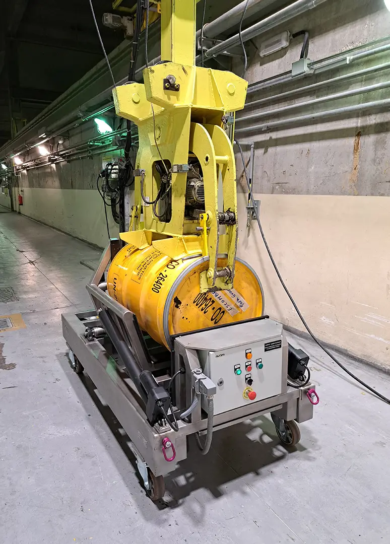 Automated clamp and rotation system handling a radioactive drum inside the temporary waste storage at Cofrentes